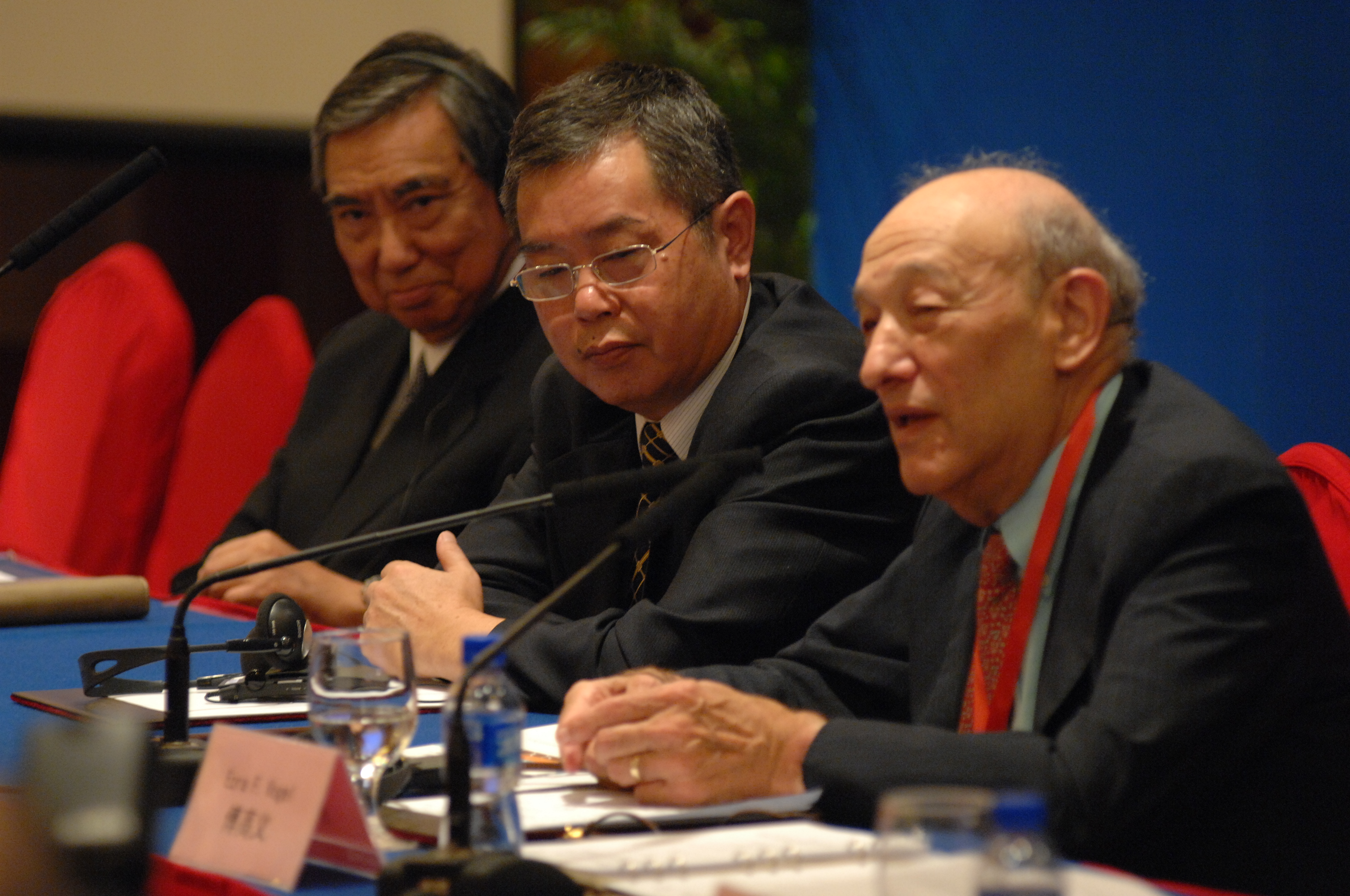 Ezra Vogel, right, speaking at the Beijing symposium on the China-Japan-US relationship with Yohei Kono, left, and Li Yang, center. 