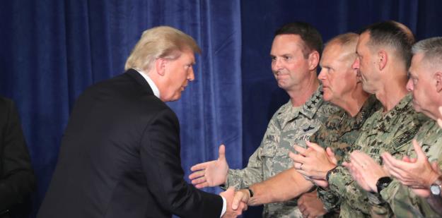 President Trump greets military leaders before his speech on Afghanistan at the Fort Myer military base on August 21, 2017 in Arlington, Virginia. ©Mark Wilson/Getty Images