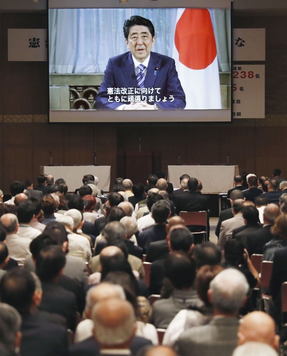 In a video message, Prime Minister Abe announces plans to push through a set of constitutional amendments. © KyodoNews 