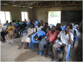 Training farmers in the classroom setting and the field.