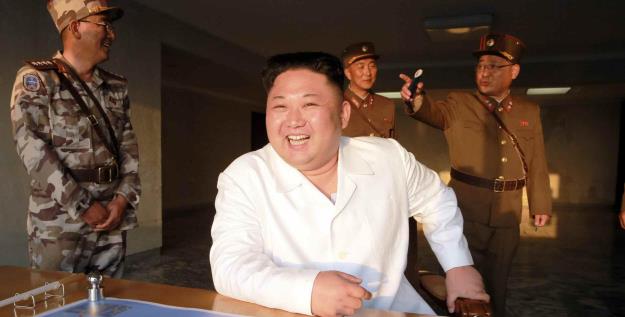 Kim Jong-un inspects a trial ballistic rocket launch. ©KPM/Kyodo News 